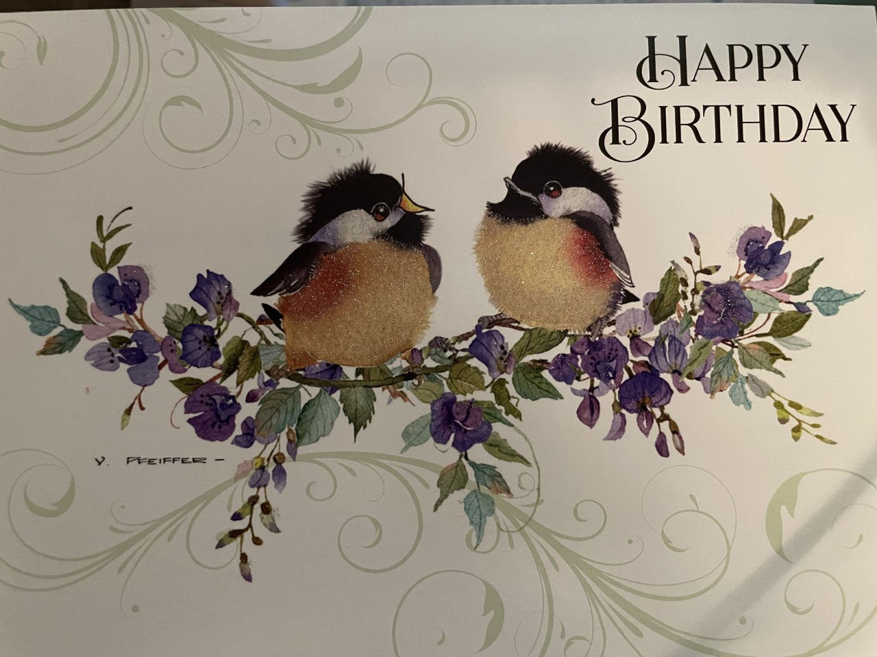 Happy Birthday! Two Lovebirds in a rea on a flower branch